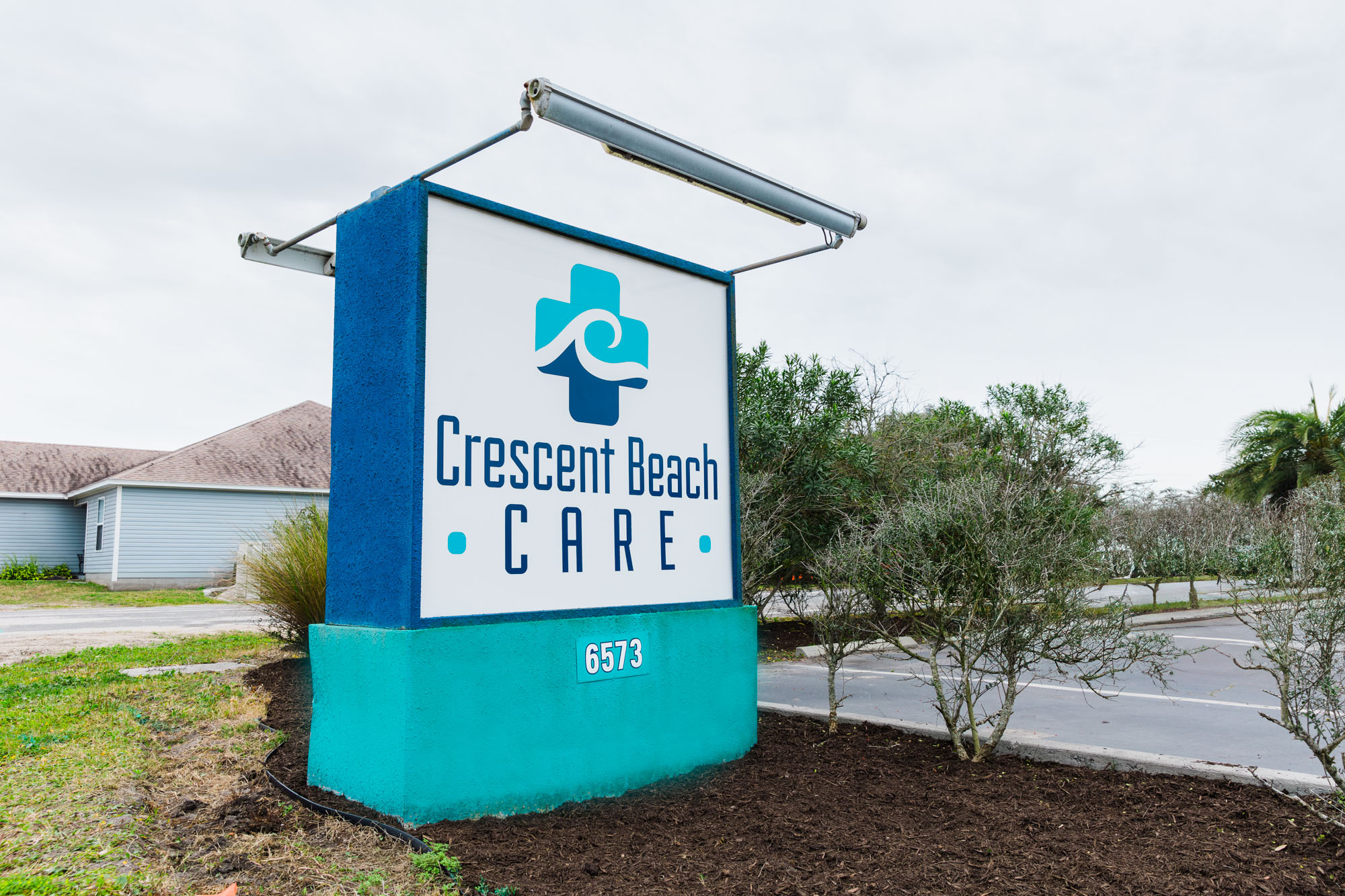Image of the Sign for Crescent Beach Care Clinic Where Providers Conduct Blood Testing in St. Augustine.